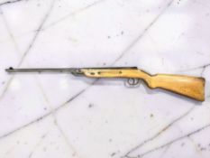 A vintage break-barrel air rifle marked Made in Germany, .