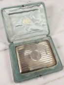 An Edward VII silver cigarette case, Birmingham 1905, length 10.5cm, in fitted case.