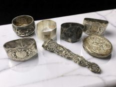 Five silver napkin rings, various,