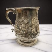 A George II silver mug, London 1728, maker's marks rubbed, engraved with the initials RMA,