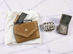 A Dune brown suede purse, with retail tags and dust cover,