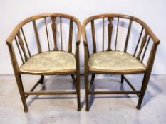 A pair of Edwardian beech horse shoe salon armchairs, width 56 cm.