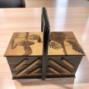 An inlaid concertina sewing box.