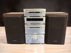 A Technics micro hi-fi system and a pair of speakers.