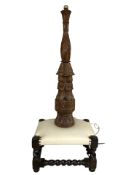 An Eastern heavily carved lamp base, height 80 cm, together with a barley twist and leather stool.