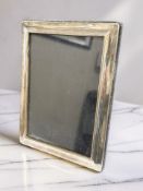 An Elizabeth II silver easel photo frame, Sheffield 1996, height 21cm.