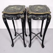 A pair of Japanese-style black lacquered jardiniere stands, height 107 cm.
