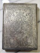 An Arabic white metal cigarette case, with elaborate engraved decoration, foreign marks, 12cm x 9.