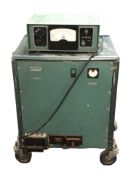 A Pye-Ling Limited G6 meter and a further field power supply on trolley castors, width 54 cm.