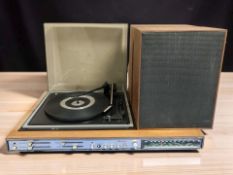 A Bush teak cased radio incorporating a BSR turntable, and a pair of teak cased speakers.