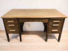 A mid-century Abbess oak twin pedestal writing desk, 150 cm x 83 cm x 78 cm.
