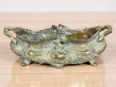 A Victorian ornate cast brass jardiniere with metal liner, width 42 cm.