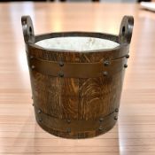 An oak and metal bound bucket or pail with ceramic liner, width 33 cm.