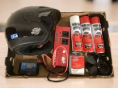 A motorbike helmet, three cans of vehicle adhesive, solar charge controller, etc.