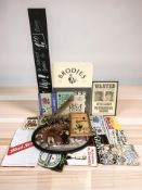 A group of reproduction advertising signs including Guinness,