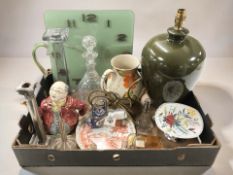 A quartz wall clock signed Karlsson, together with candlesticks, glass decanter, pottery lamp base,