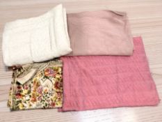 A group of vintage quilts and throws.
