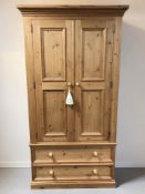A modern pine double door wardrobe, 104 cm x 56 cm x 195 cm.