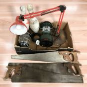 Three vintage saws, two storm lights, two bowling pins and an angle poise lamp.