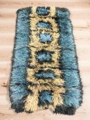 A 1970's Scandinavian tasseled pile rug, 140 cm x 79 cm.