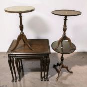 A mahogany nest of tables and three various tripod tables.