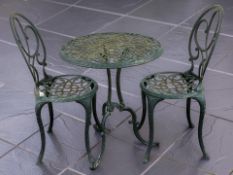 A painted aluminium garden patio table and two chairs, table 61 cm diameter.