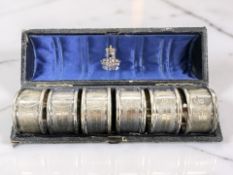A set of six EPNS napkin rings, cased.