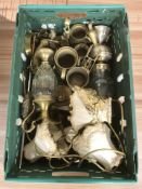 A group of brass tankards, lamp bases and other metal wares.