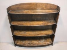 An Edwardian oak waterfall open bookcase, width 91 cm.