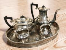 An EPNS four piece tea service, retailed by Garrard & Co, and a twin handled serving platter.