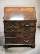 A George III-style inlaid mahogany fall front bureau, width 76 cm.