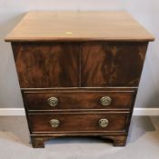 A Georgian-style mahogany single door cabinet with faux drawers, width 65 cm.
