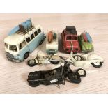 A group of tin plate vehicle models, camper van, etc, largest 40 cm long.