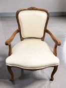 A reproduction French-style salon armchair.