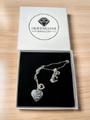 A silver heart-shaped pendant.
