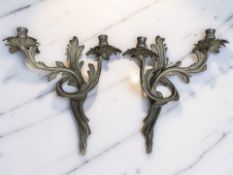 A pair of gilt metal Rococo-style twin branch wall light sconces, height 35 cm.