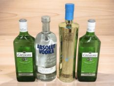 Two bottles of Greyson's London Dry gin, 37.5% vol, 70cl, a bottle of Au Vodka blue raspberry, 35.