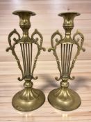 A pair of brass Lyre-shaped candlesticks, height 30 cm.