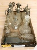 A group of EPNS mounted claret jugs, glass decanters, etc.