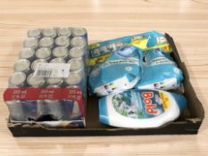 A group of new laundry detergent products and a pack of Red Bull energy drink cans.