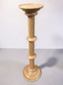 A reproduction turned beech torchere, height 98 cm.