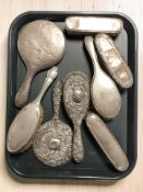 Eight antique silver mounted dressing table brushes / hand mirrors, longest 26 cm.