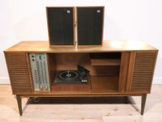 A 20th century teak cased entertainment sideboard fitted with a Philips turntable, width 132 cm,