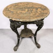 A cast iron Britannia-style pub table with barrel lid top, height 70 cm.