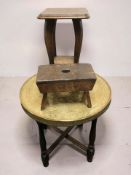 An Islamic brass topped occasional table, an oak jardiniere stand, and a 19th century oak cracket.