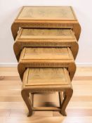 An Eastern carved camphorwood nest of four tables, width 55 cm.