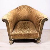 An early 20th century carved beech tub armchair on shepherd's castors, width 80 cm.