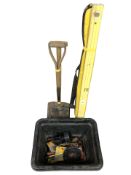 A box of various hand tools and hardware, a large spirit level, two spades.