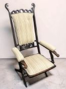 An early 20th century folding beech armchair, width 60 cm.