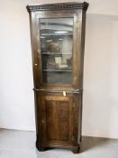 A George III style oak corner cabinet, height 210 cm.